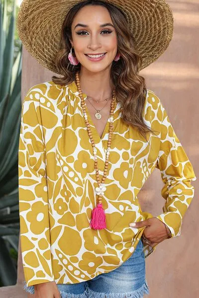 Printed Notched Long Sleeve Blouse sold by Charming Charlie