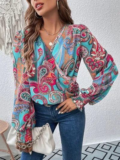 Printed Surplice Smocked Lantern Sleeve Blouse sold by Charming Charlie