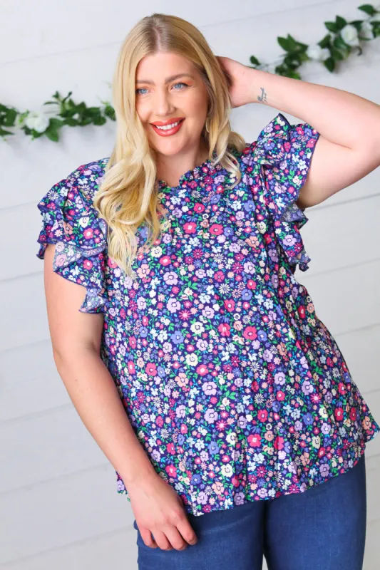 Navy Floral Mock Neck Flutter Sleeve Top sold by Charming Charlie