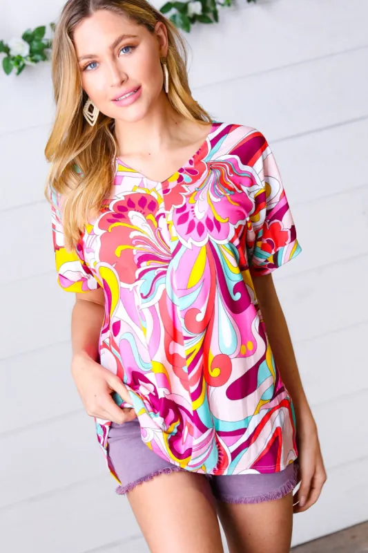 Orange & Pink Geometric Floral V Neck Top sold by Charming Charlie