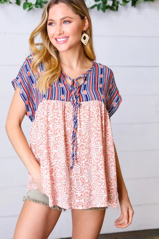 Navy & Coral Boho Tie Neck Dolman Top sold by Charming Charlie