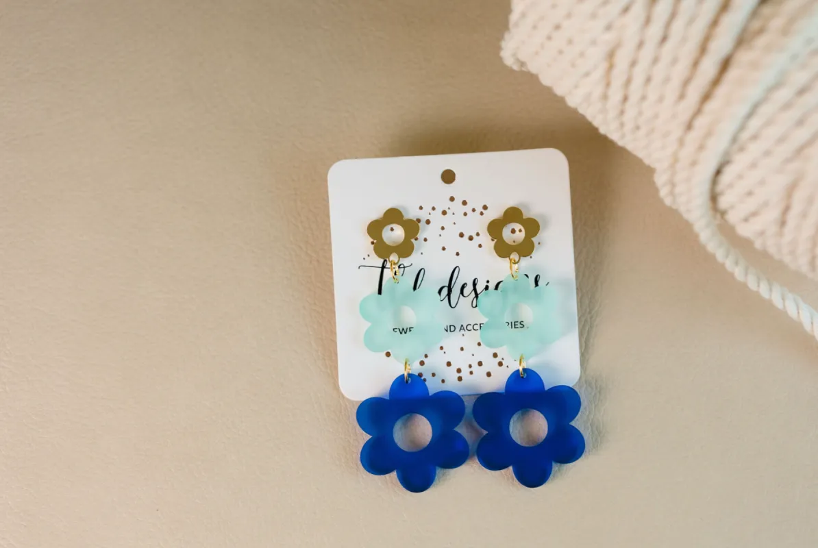 Blue Floral Acrylic Drop Earring sold by Charming Charlie