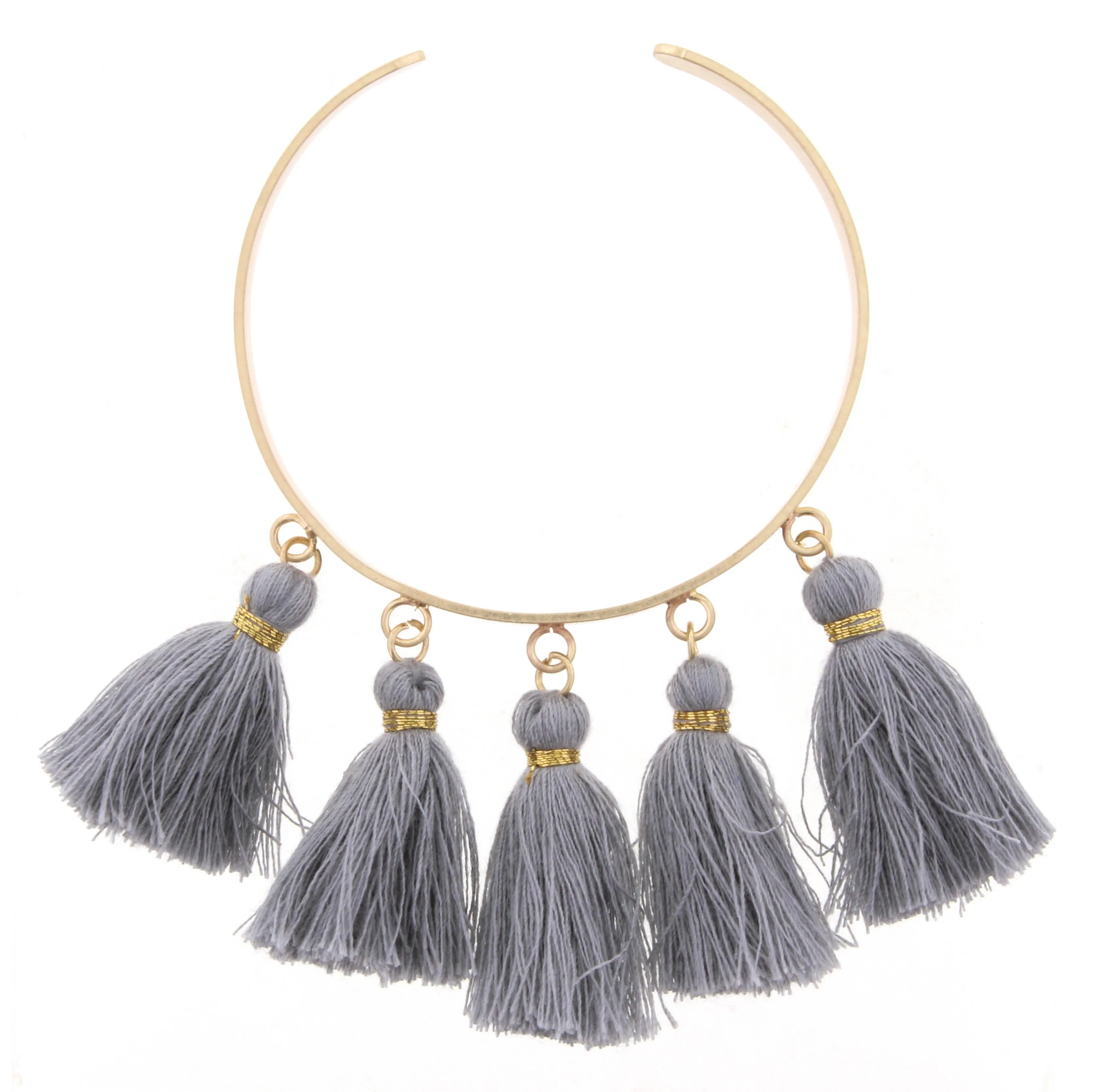 Gold Metal Cuff Bracelet with Grey Tassels sold by Charming Charlie