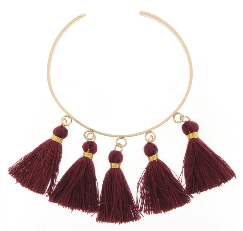 Gold Metal Cuff Bracelet with Maroon Tassels sold by Charming Charlie