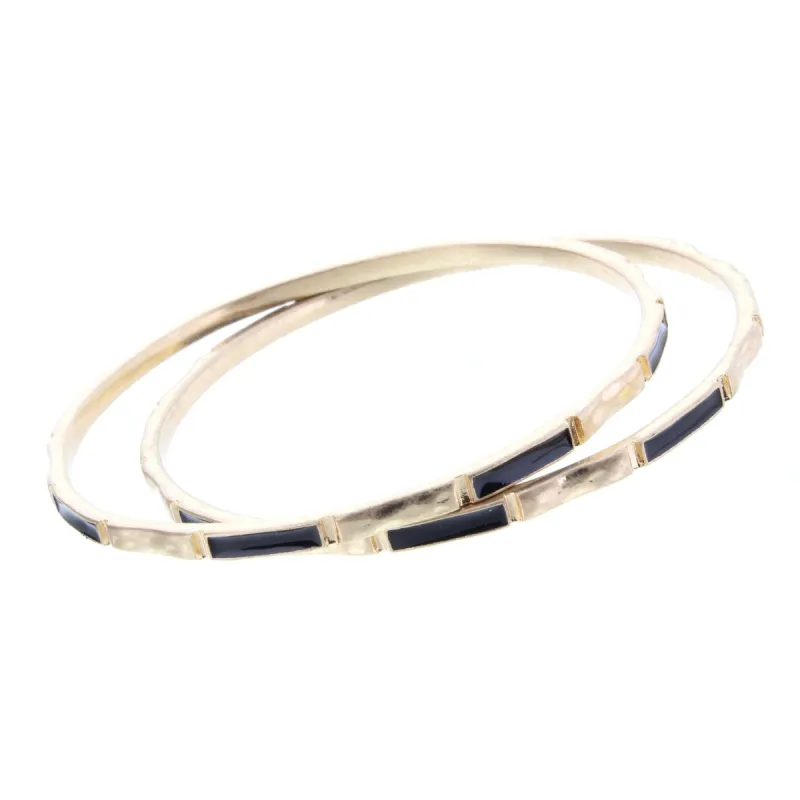2 Blocked off Gold Bangle Bracelets  with Jet Epoxy sold by Charming Charlie