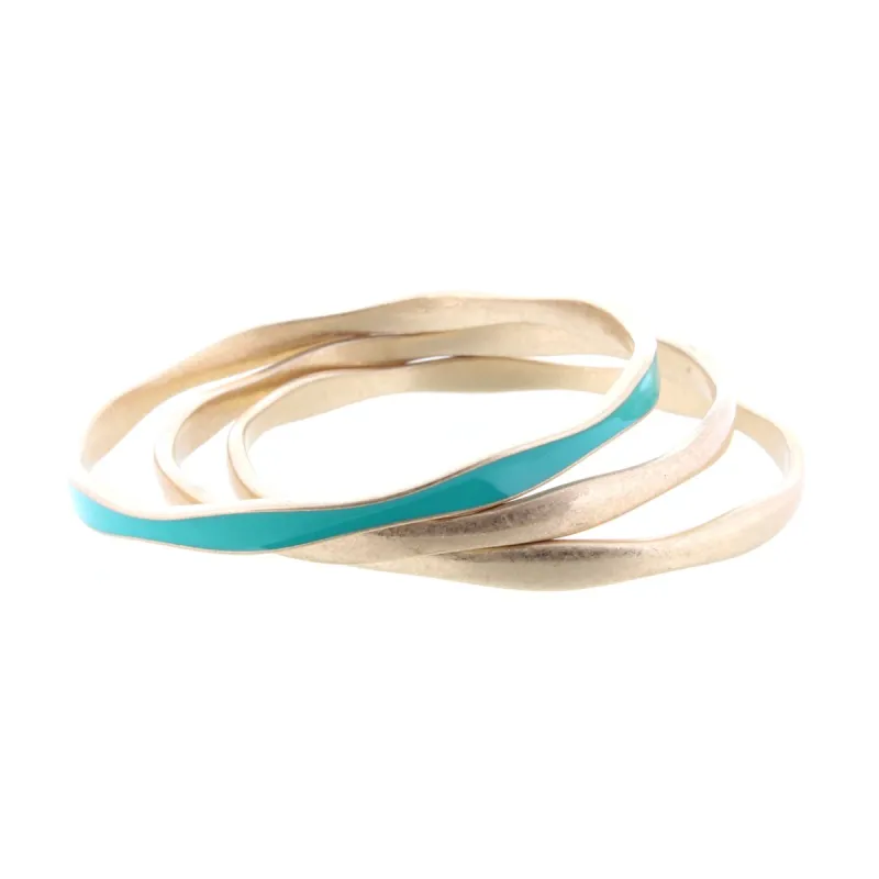 3 Gold Wavy Bangle Bracelets with One Turquoise Epoxy Accent sold by Charming Charlie