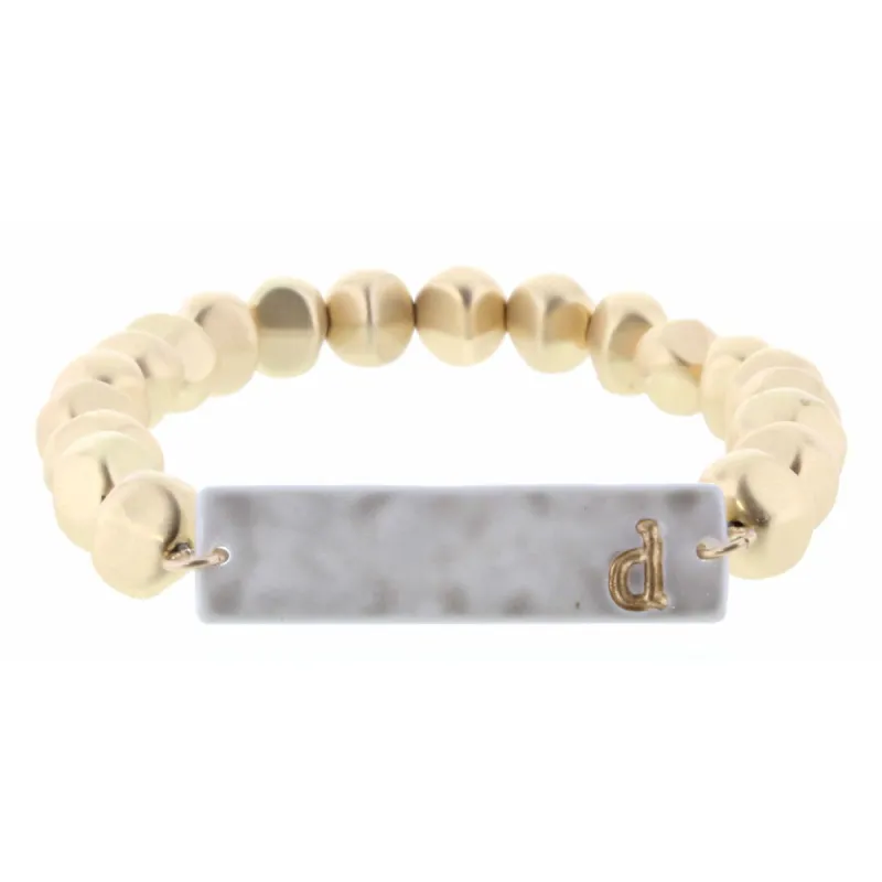 Gold Beaded Stretch, Grey Ceramic Rectangle with "D" Initial Bracelet sold by Charming Charlie