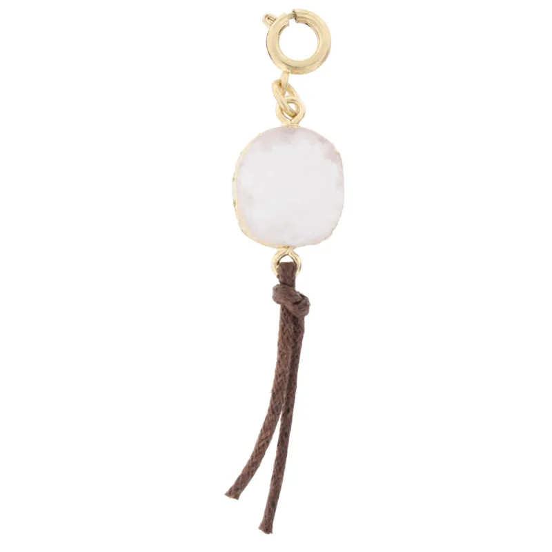 White Druzy Charm with Leather Tassel Charm sold by Charming Charlie