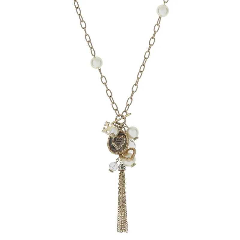 Open Heart Pearl Station, Epoxy and Charm Tassel Necklace sold by Charming Charlie