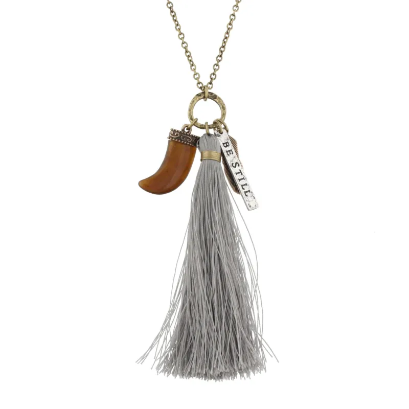 32" Gold Chain Necklace with Grey Tassel, Brown Horn, Feather and "Be Still" Charms, 3" Ext. sold by Charming Charlie
