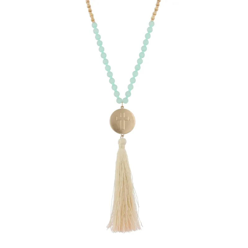 30" Mint And Wooden Bead Necklace with Gold Cross Charm And Ivory Tassel, 3" Ext. sold by Charming Charlie