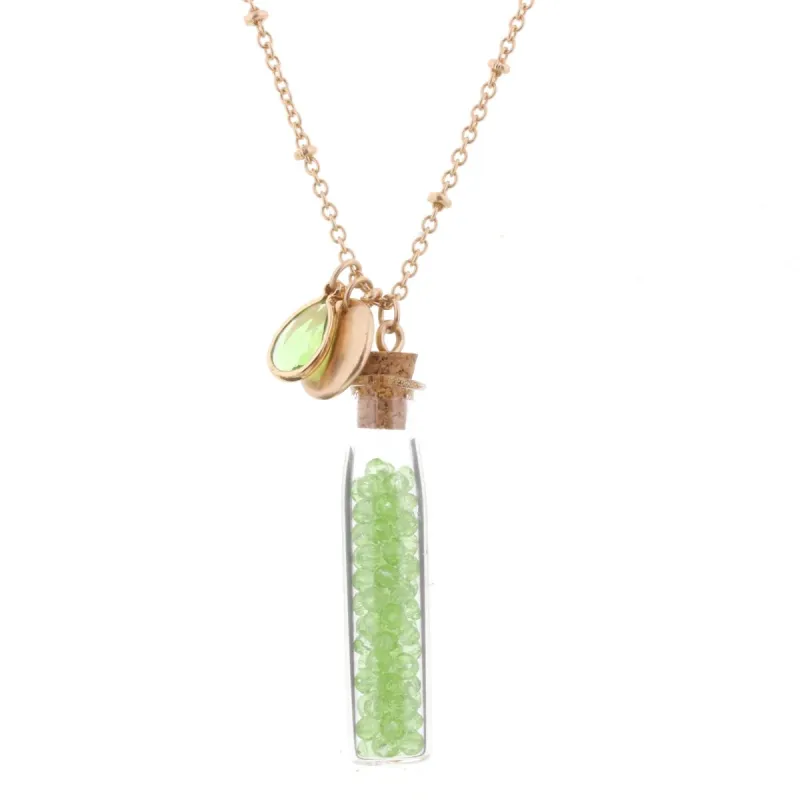 30" Necklace with Peridot Bead Filled Bottle, 3" Ext. sold by Charming Charlie