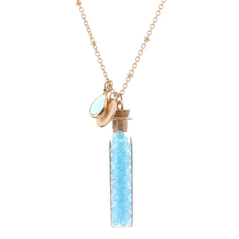30" Necklace with Blue Topaz Bead Filled Bottle, 3" Ext. sold by Charming Charlie