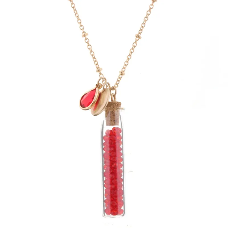 30" Necklace with Ruby Bead Filled Bottle, 3" Ext. sold by Charming Charlie