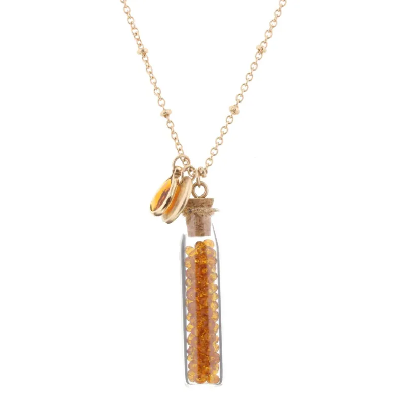 30" Necklace with Topaz Bead Filled Bottle, 3" Ext. sold by Charming Charlie