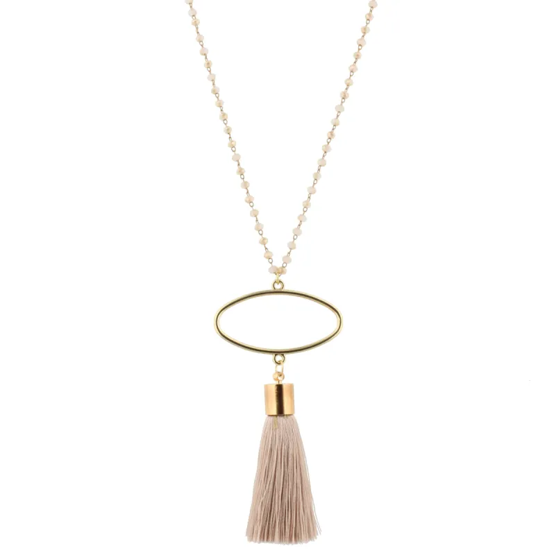 28" 2-Tone Champagne Beaded Necklace with Oval & Beige Tassel, 3" Ext. sold by Charming Charlie