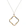 32" Gold Chain Necklace with Open Tortoise Resin Ornate Shape with AB Stone, 3" Ext. sold by Charming Charlie