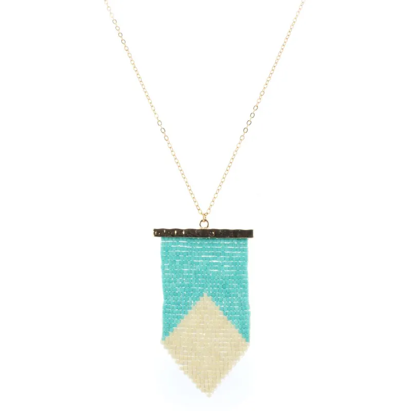 32" Gold Chain Necklace with Turquoise & Cream Beaded Shield, 3" Ext. sold by Charming Charlie