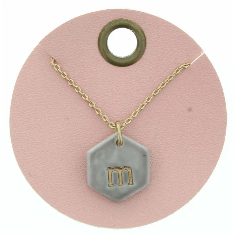 16" Grey Stamped Initial "M" Hexagon Necklace, 3" Ext. sold by Charming Charlie