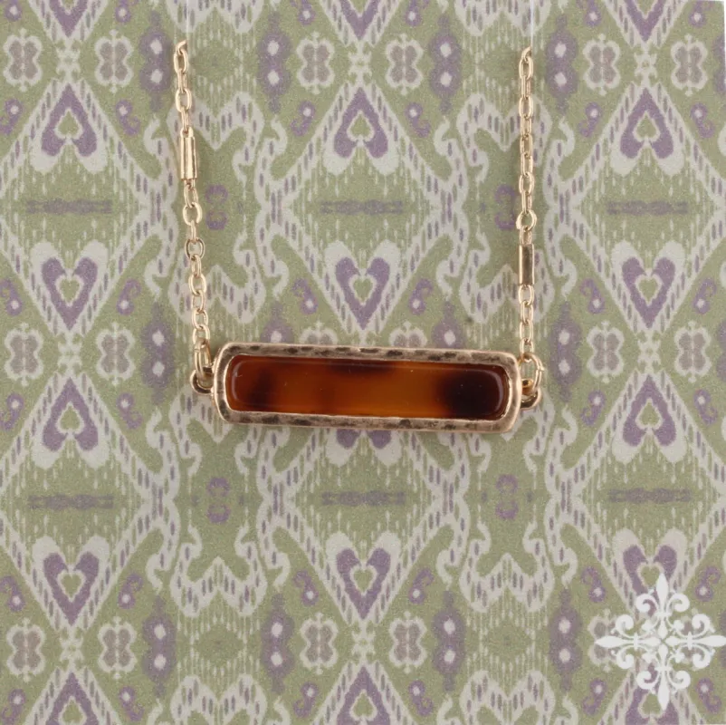 16" Brown Resin Bar Necklace, 3" Ext. sold by Charming Charlie