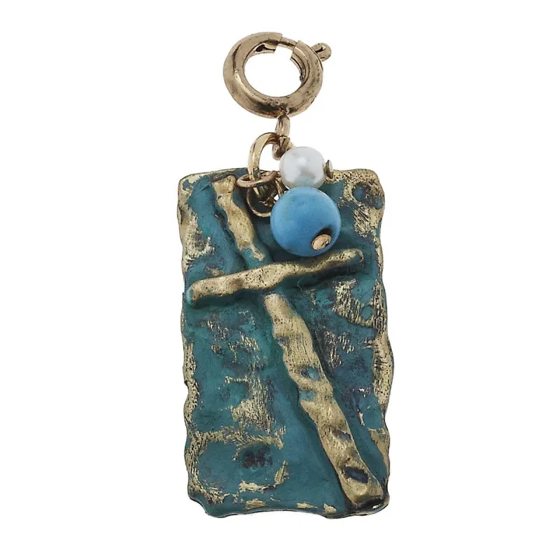 Patina Cross Charm sold by Charming Charlie