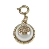 Ivory Pearl Cabochon with Antique Gold Bumble Bee Charm sold by Charming Charlie