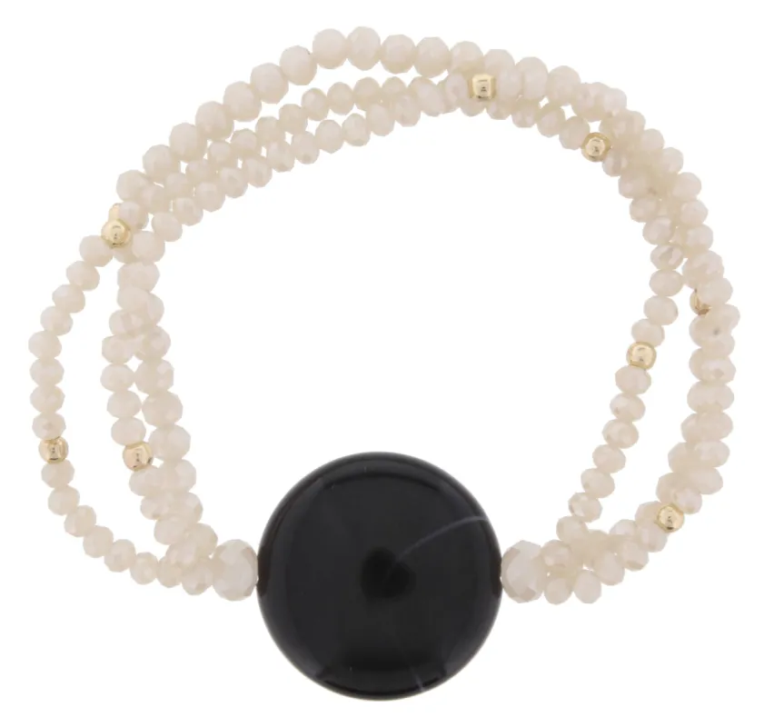 Nude Beaded 3 Strand Stretch Bracelet with Jet Circle sold by Charming Charlie