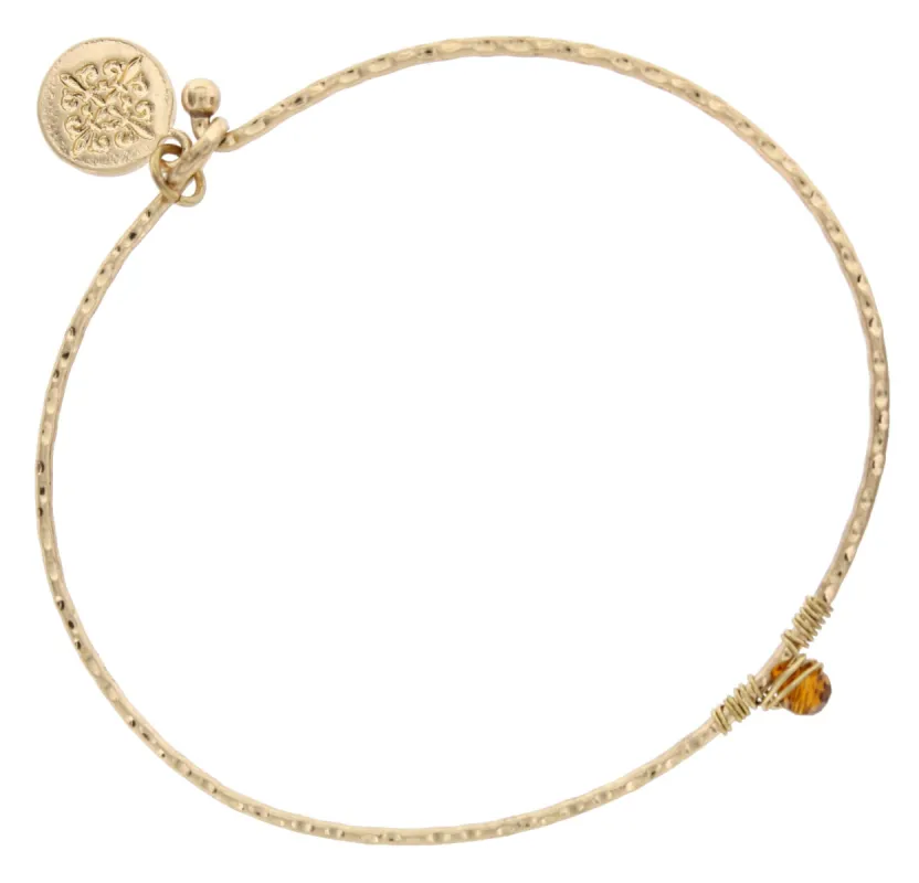 Worn Gold Bangle with Dark Brown Wire Wrapped Stone made by Charming Charlie
