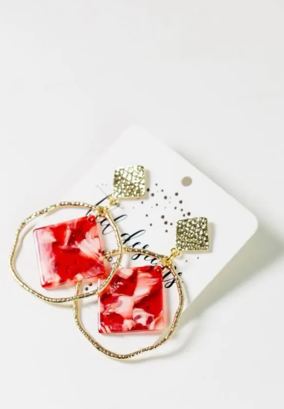 Apple Circular Drop Earrings sold by Charming Charlie