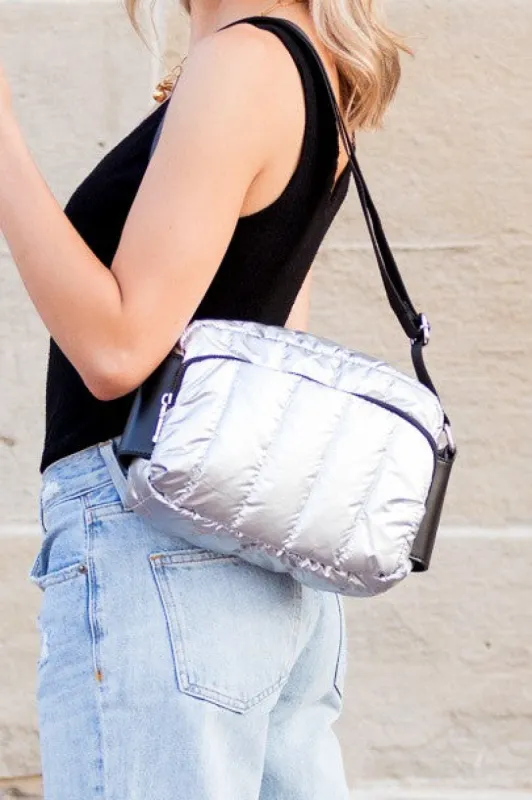 River Metallic Puffer Crossbody sold by Charming Charlie