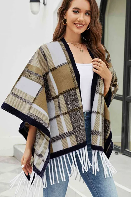 Cloak Sleeve Fringe Detail Poncho sold by Charming Charlie