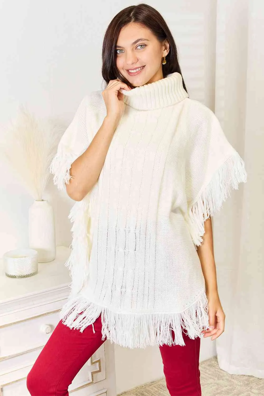 Justin Taylor Turtle Neck Fringe Poncho sold by Charming Charlie