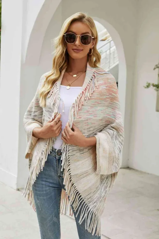 Multicolored Fringe Trim Poncho sold by Charming Charlie