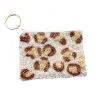 Snow Leopard Keychain Pouch sold by Charming Charlie