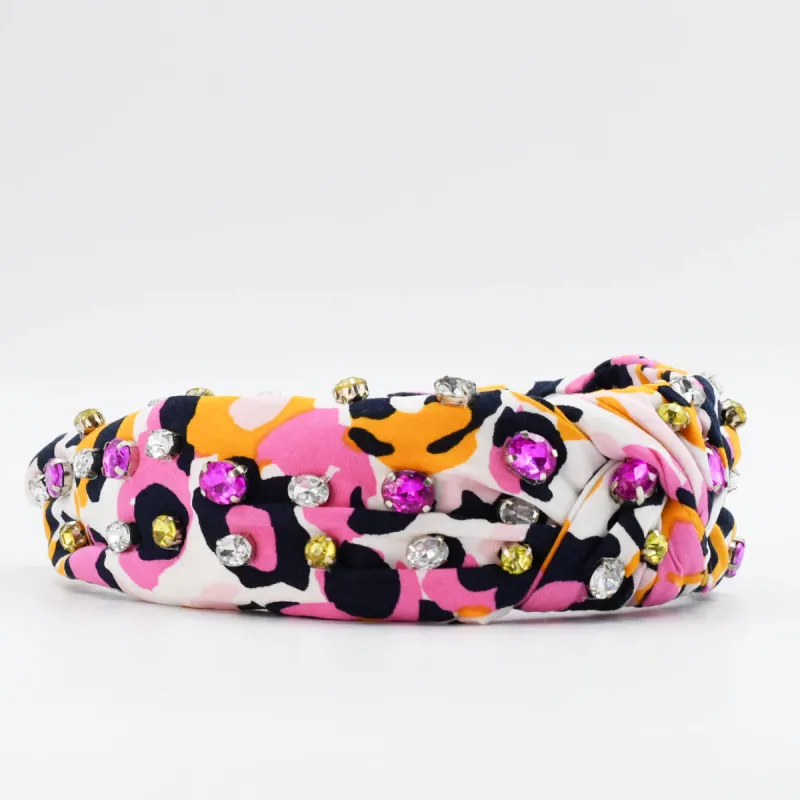 Pink/Orange Animal Print Headband sold by Charming Charlie