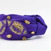 Purple/Gold Football Headband sold by Charming Charlie