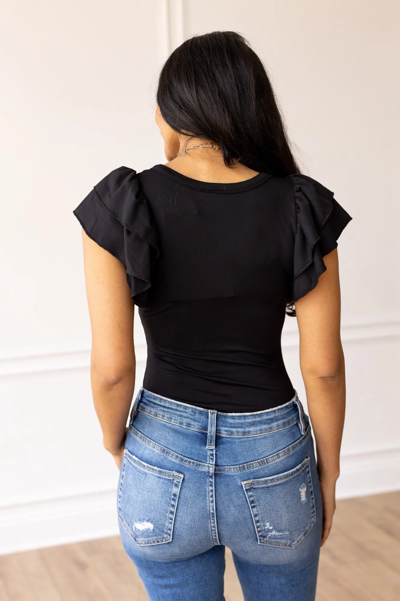The Eloise Ruffle Sleeve Bodysuit, Black sold by Charming Charlie product image thumbnail 3