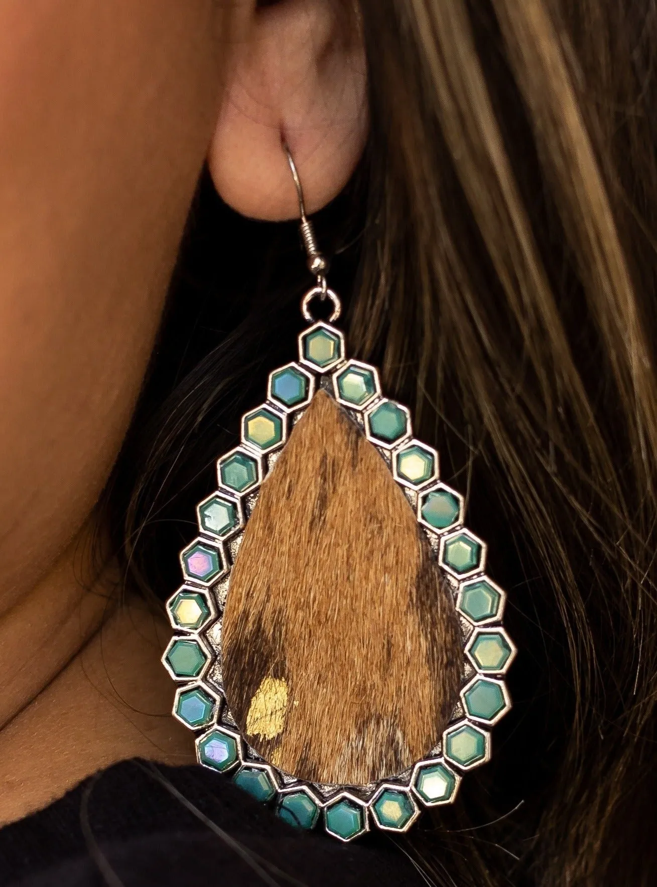 Desert Dreams: Cowhide and Turquoise Crystal Teardrop Earrings sold by Charming Charlie