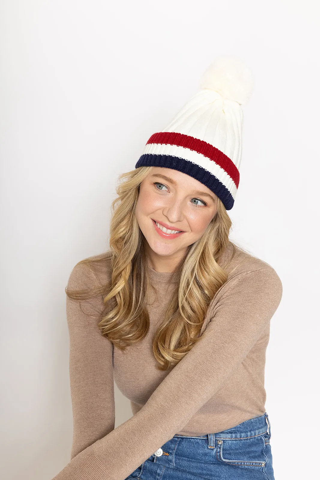 Stripe Rib Beanie With Faux Fur Pom sold by Charming Charlie
