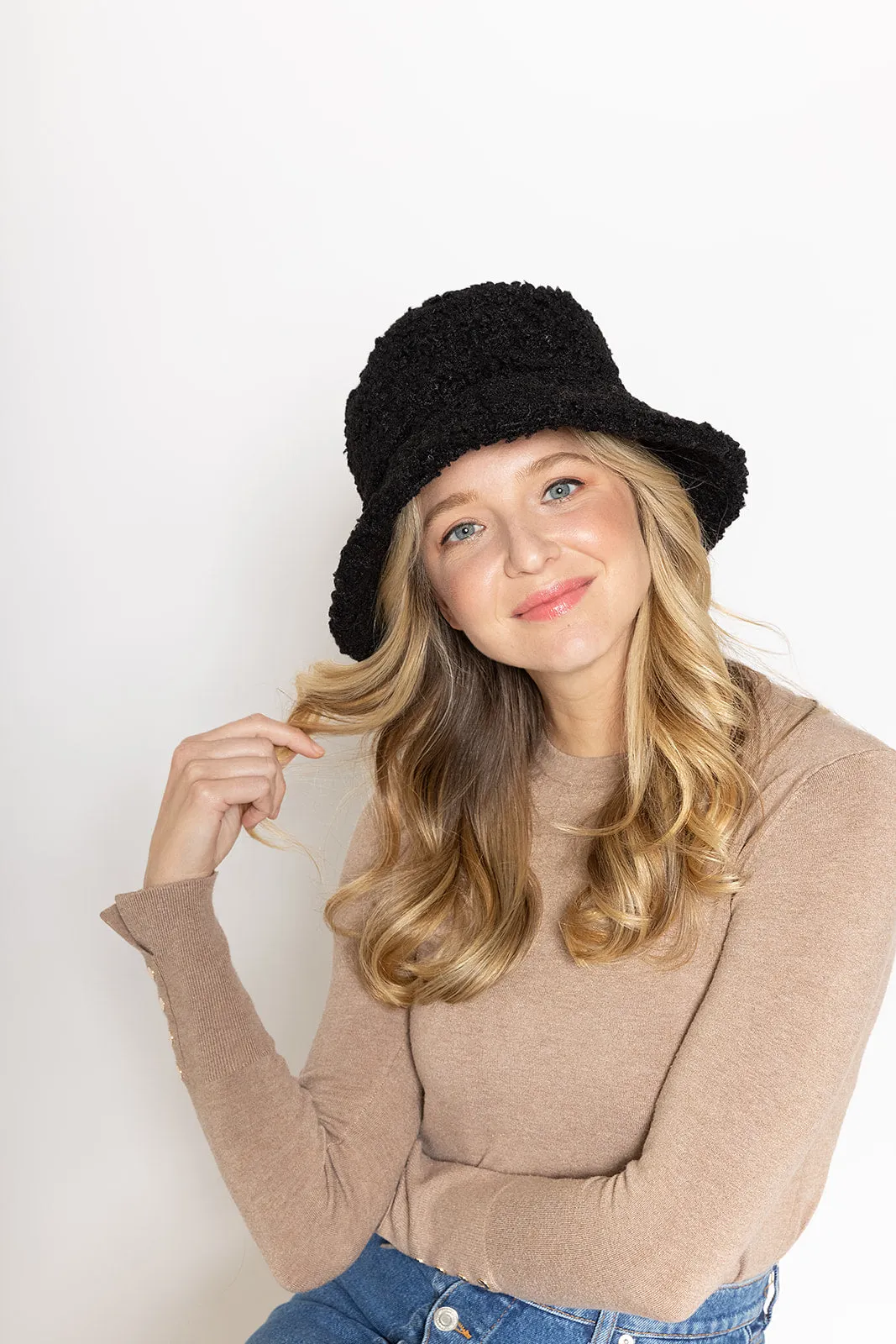 Teddy Bucket Hat sold by Charming Charlie