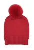 Solid Knit Beanie With Faux Fur Pom sold by Charming Charlie