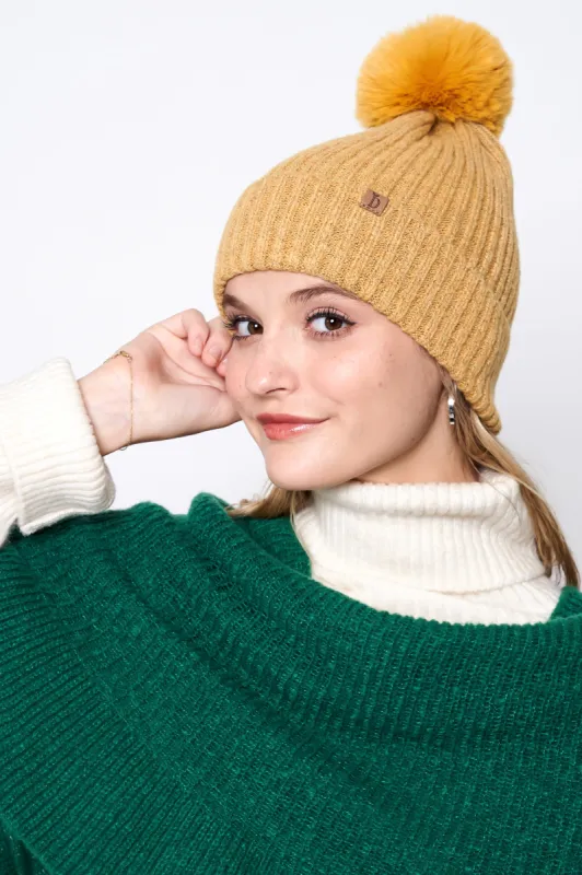 Ribbed Knit Beanie With Faux Fur Pom sold by Charming Charlie