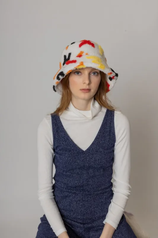 Alphabet Sherpa Bucket Hat sold by Charming Charlie
