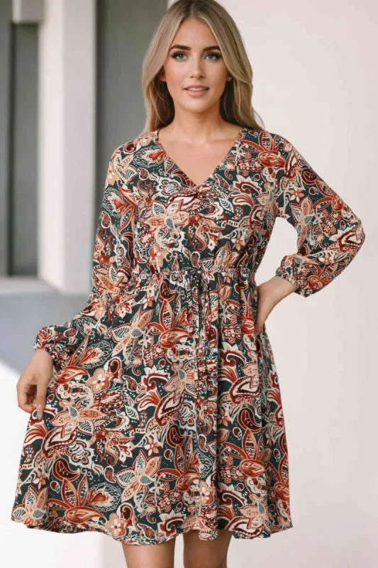 Printed V-Neck Mini Dress sold by Charming Charlie