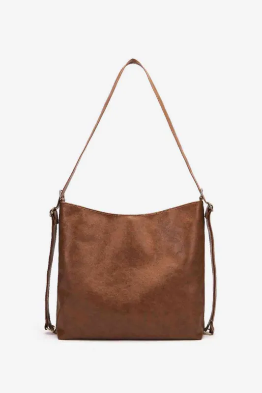 Large PU Leather Crossbody Bag sold by Charming Charlie