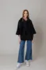 Faux Fur Cape With Hood sold by Charming Charlie
