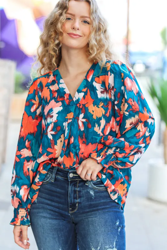 All I Ask Teal Floral Abstract Print V Neck Smocked Top sold by Charming Charlie