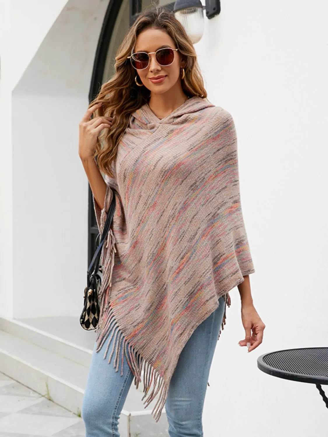 Fringe Hem Hooded Poncho sold by Charming Charlie