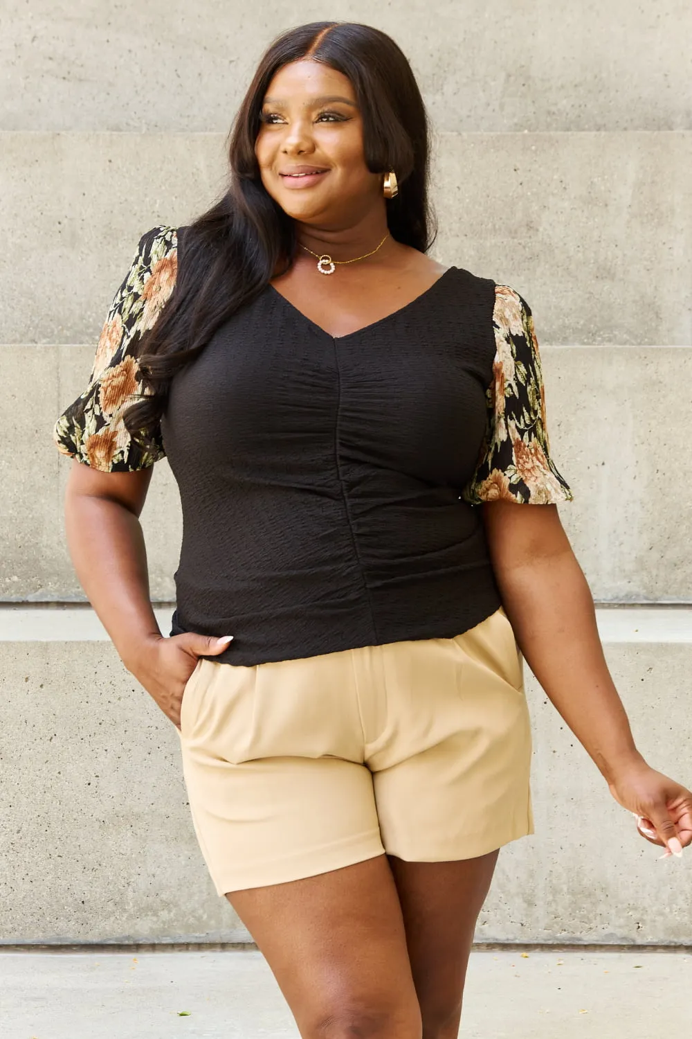 And The Why Hold Me Close Full Size Floral Print Textured Sleeve Knit Top sold by Charming Charlie