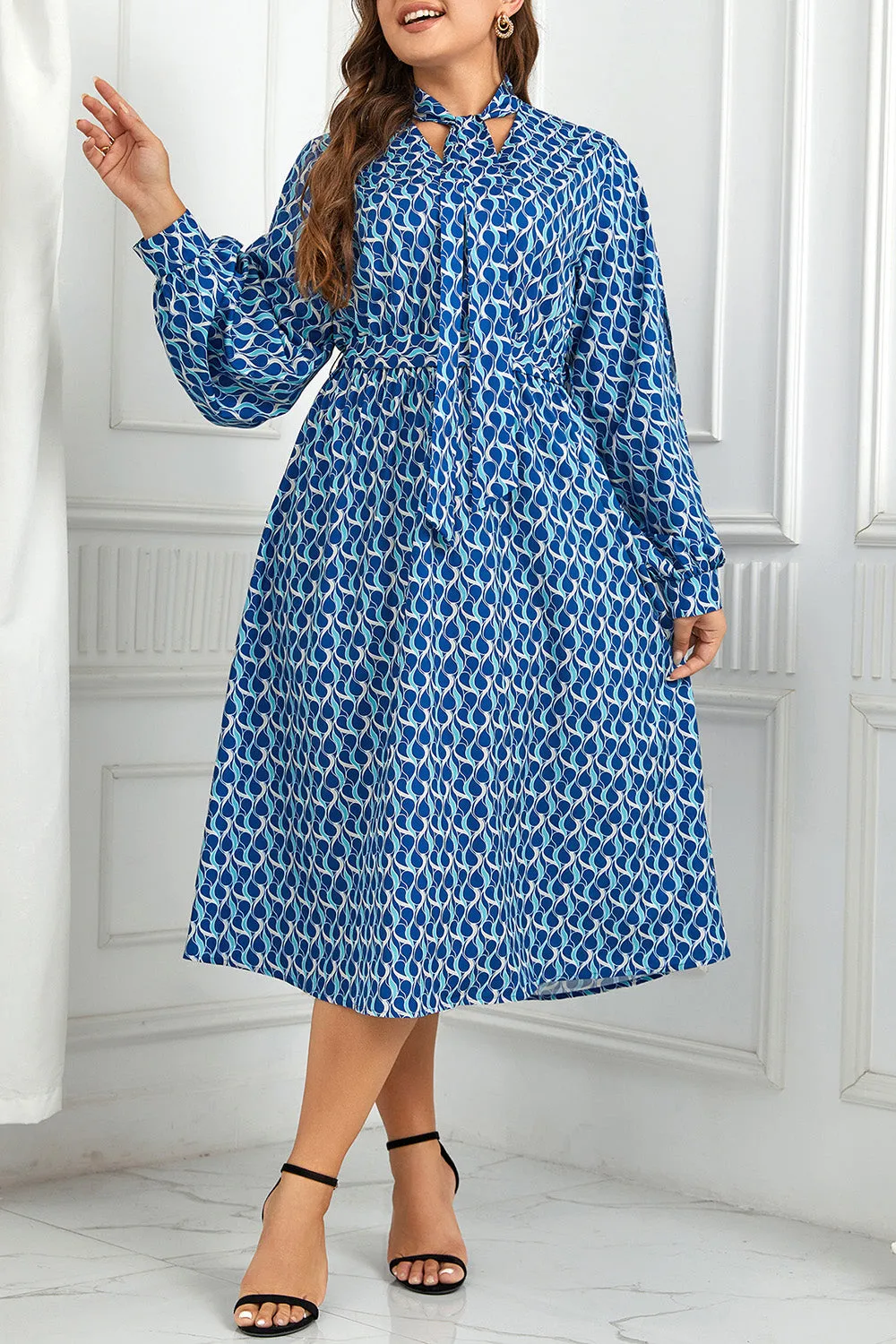 Plus Size Printed Tie Neck Midi Dress sold by Charming Charlie